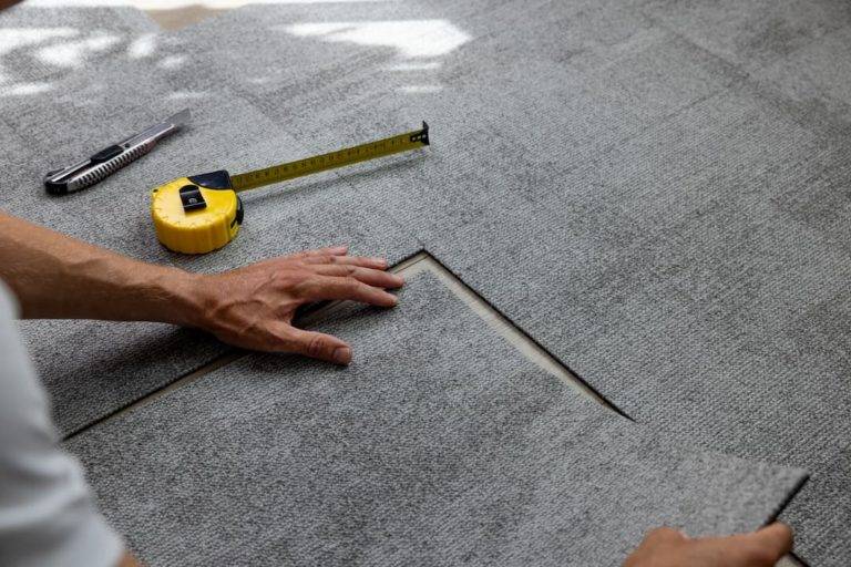 Grey Carpet Tiles Being Installed